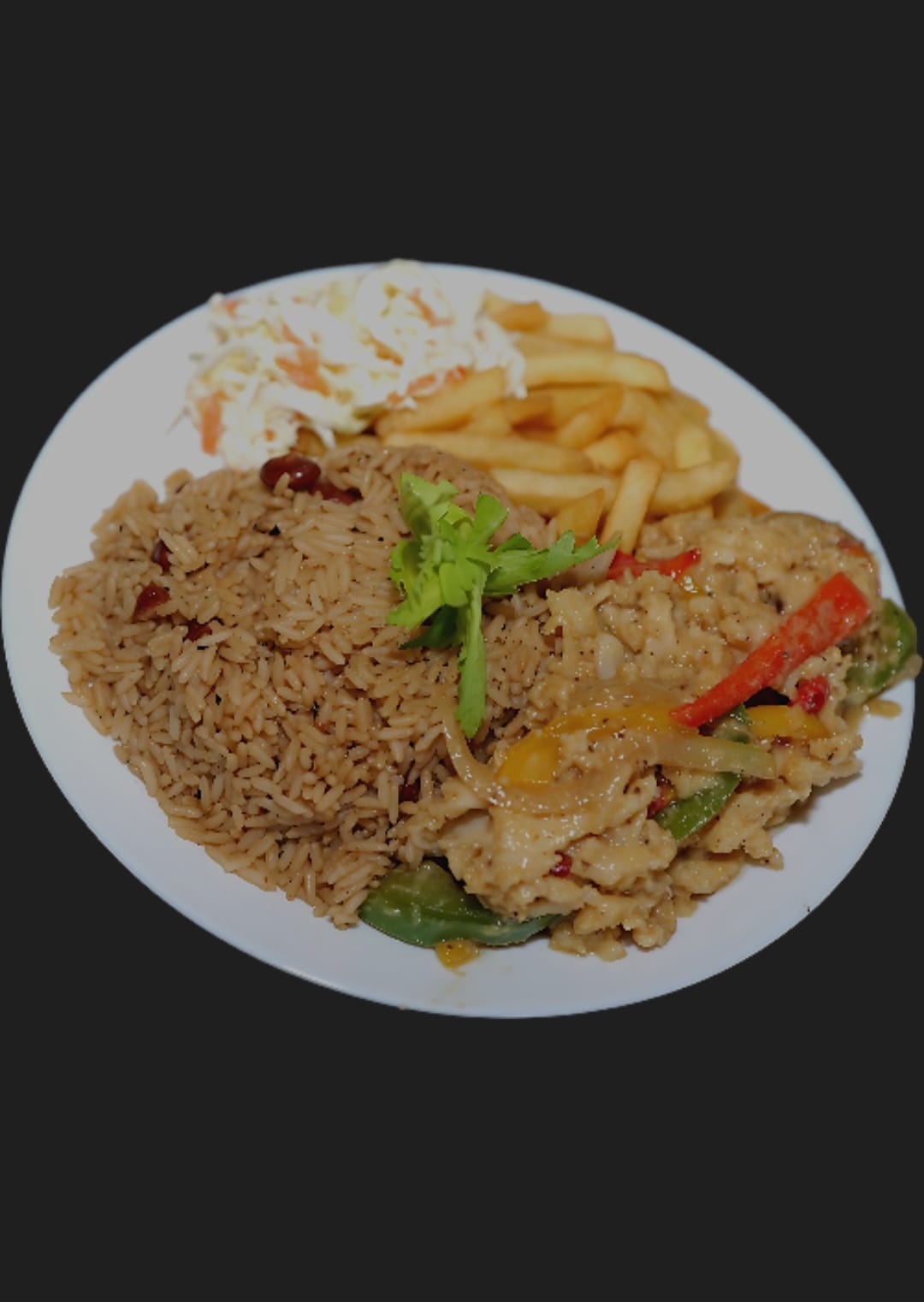 Plate of seasoned rice with stewed chicken, peppers, fries and coleslaw
